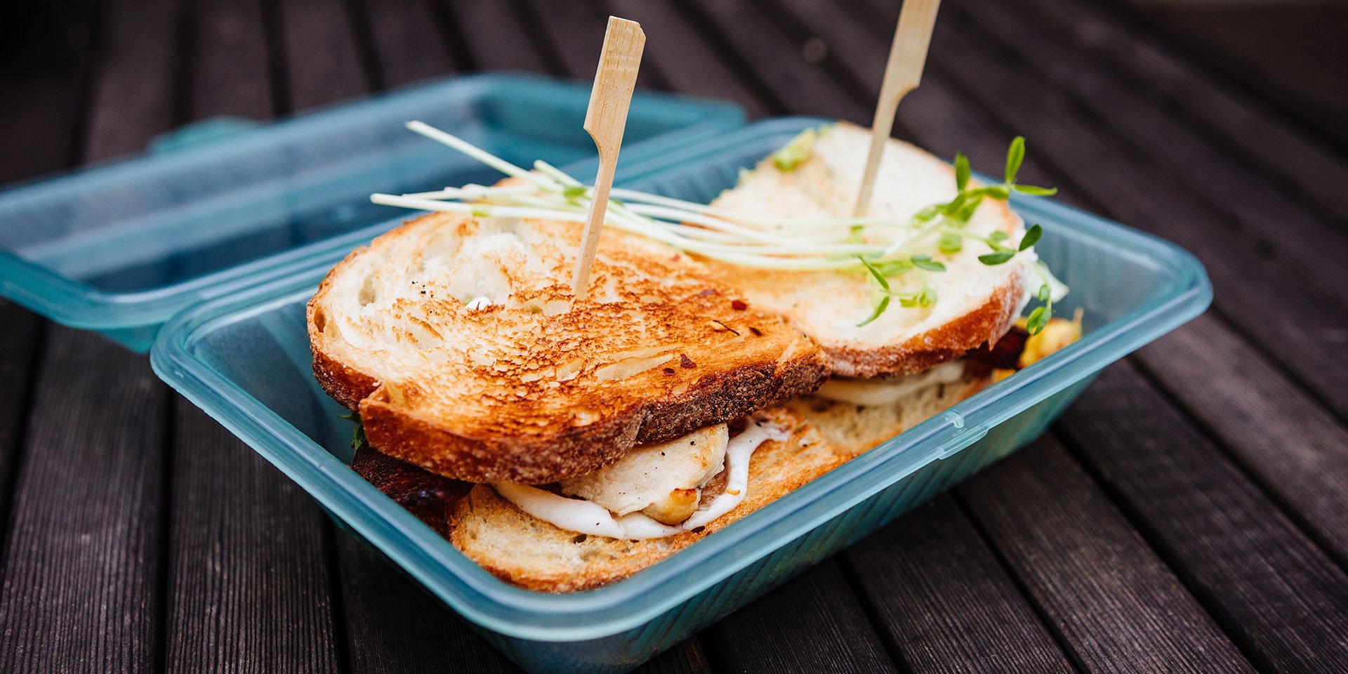 sandwich in a reusable takeout container