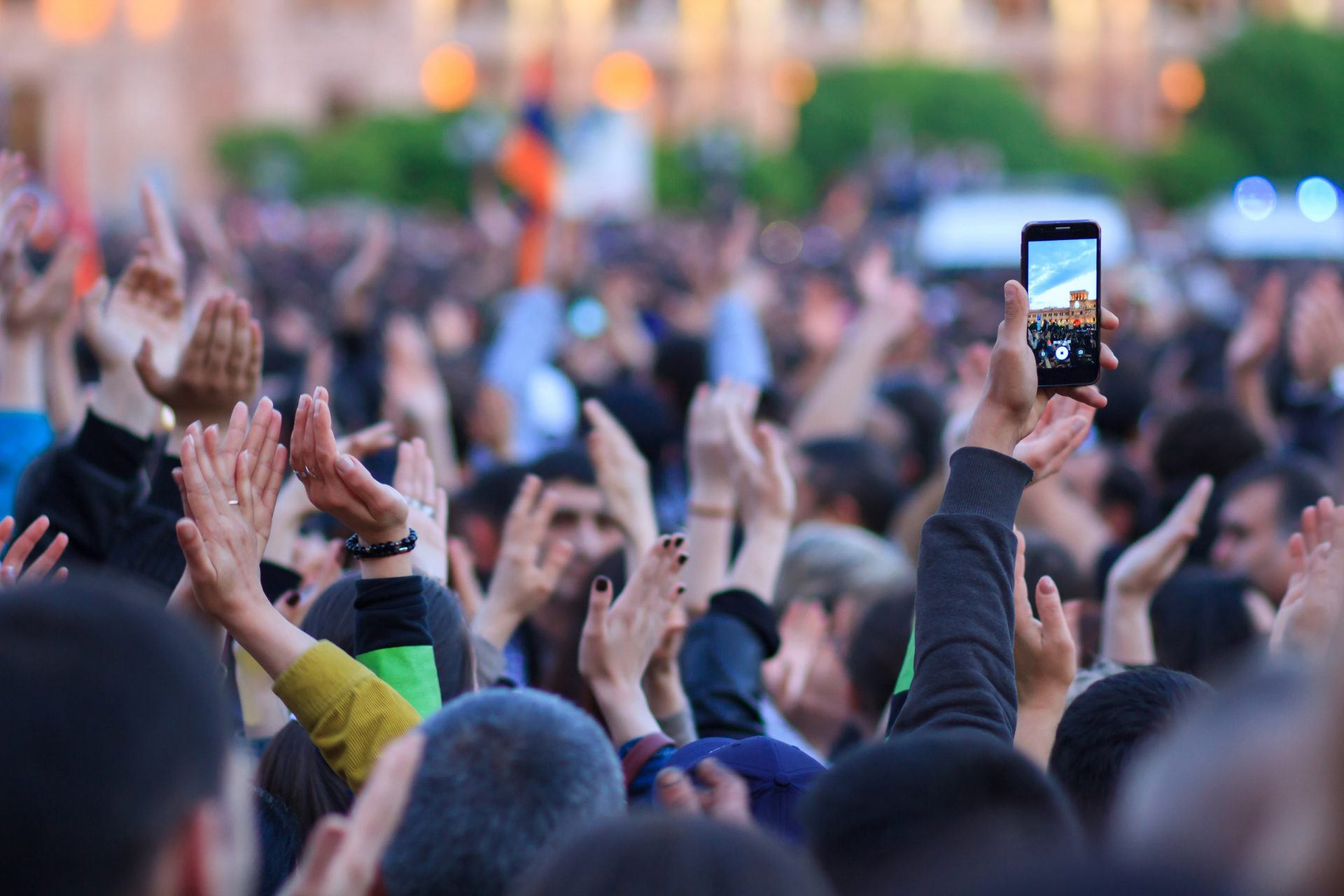 Group of protesting people hands up