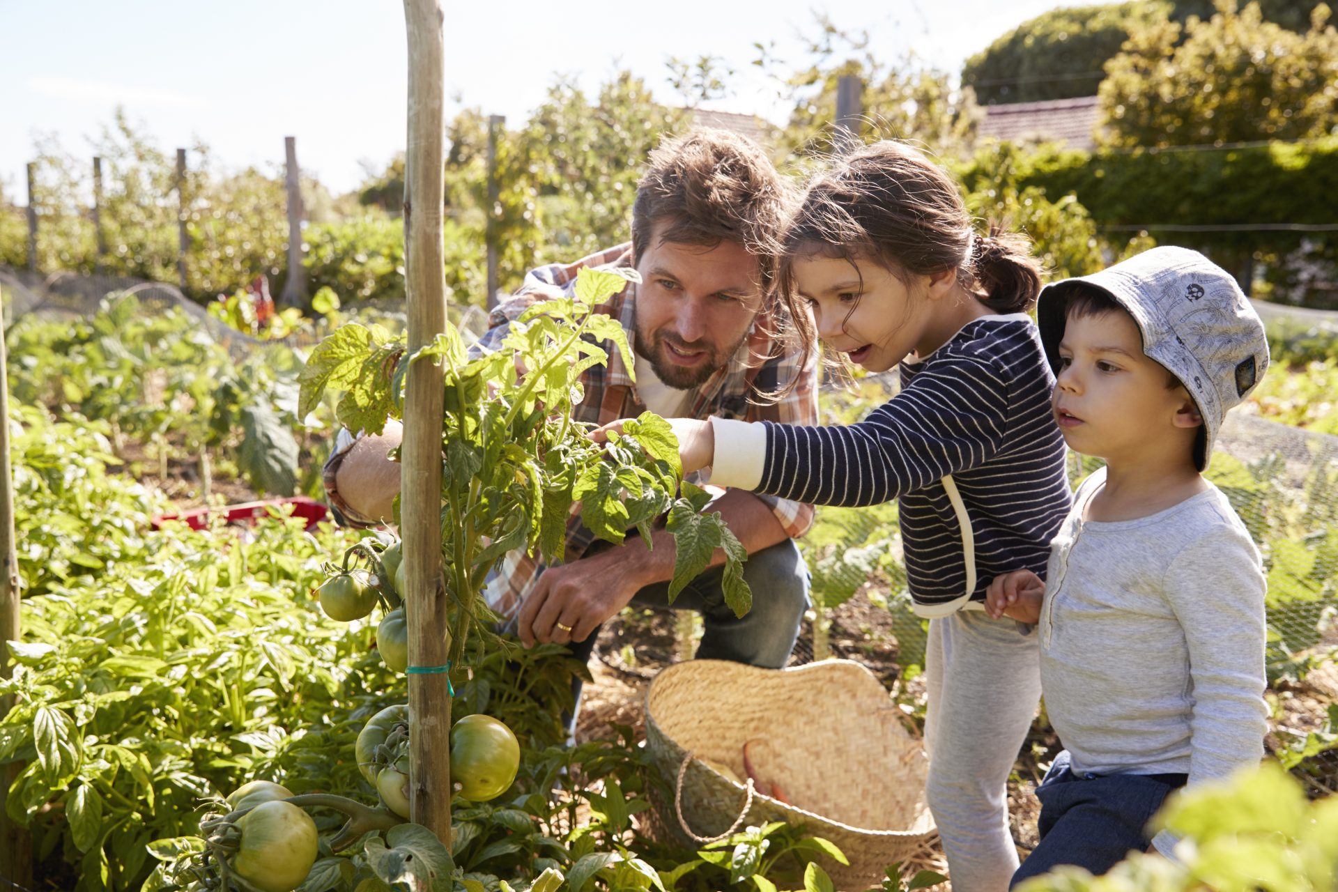 adult and children in garden